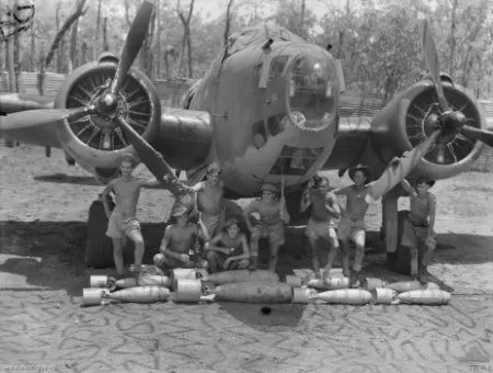 Crew of No. 2 Squadron RAAF with their Hudson bomber and ordnance.