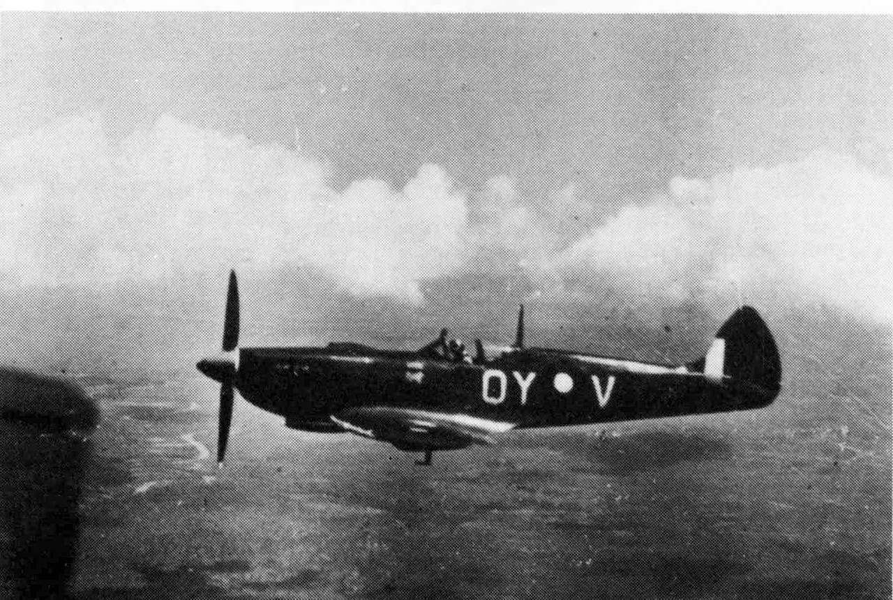 Squadron Leader Lou Spence, C.O. 452 Squadron, flies a Spitfire Mark VIII over the Darwin area, 1944.